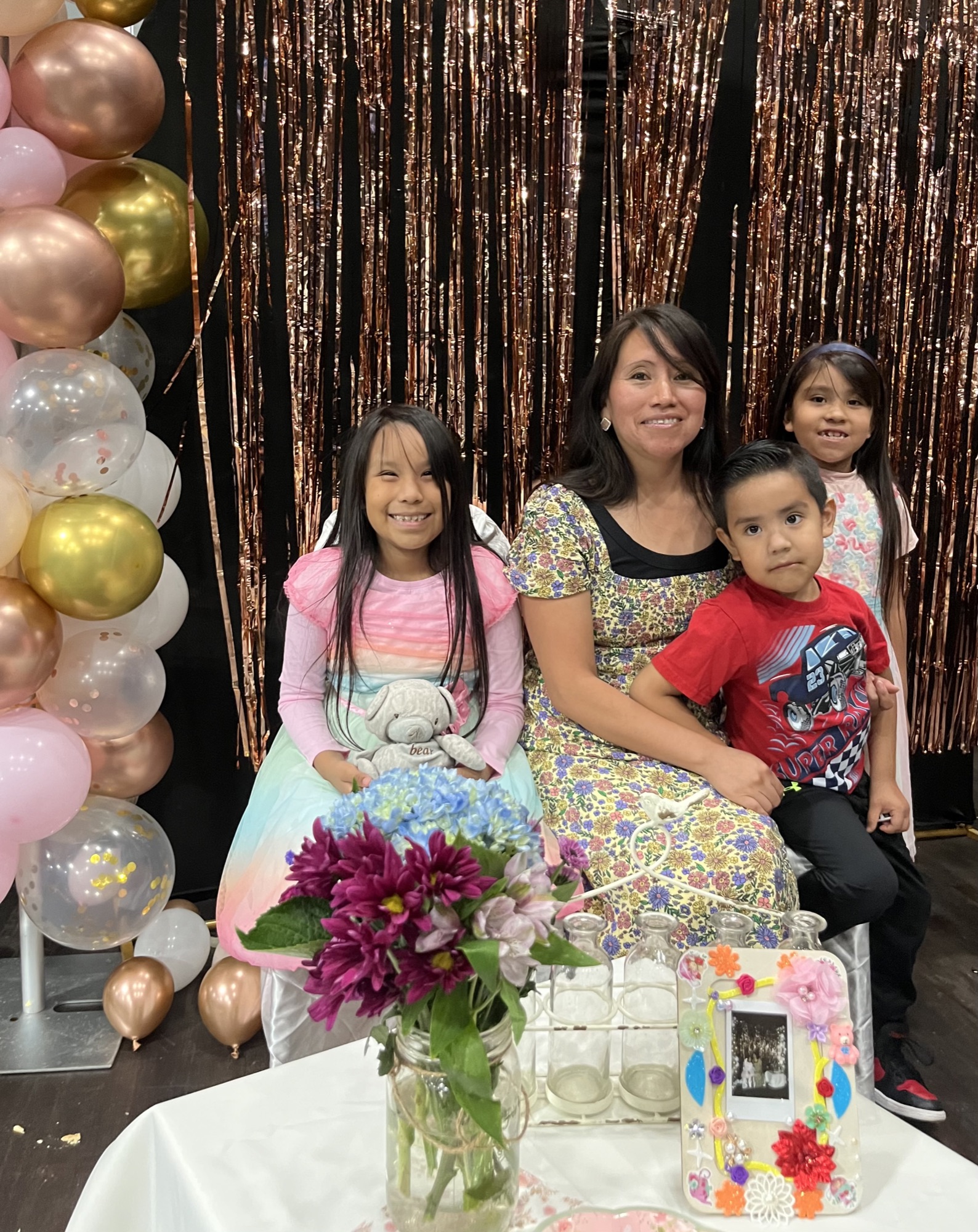 A mom and her three kids at a family celebration